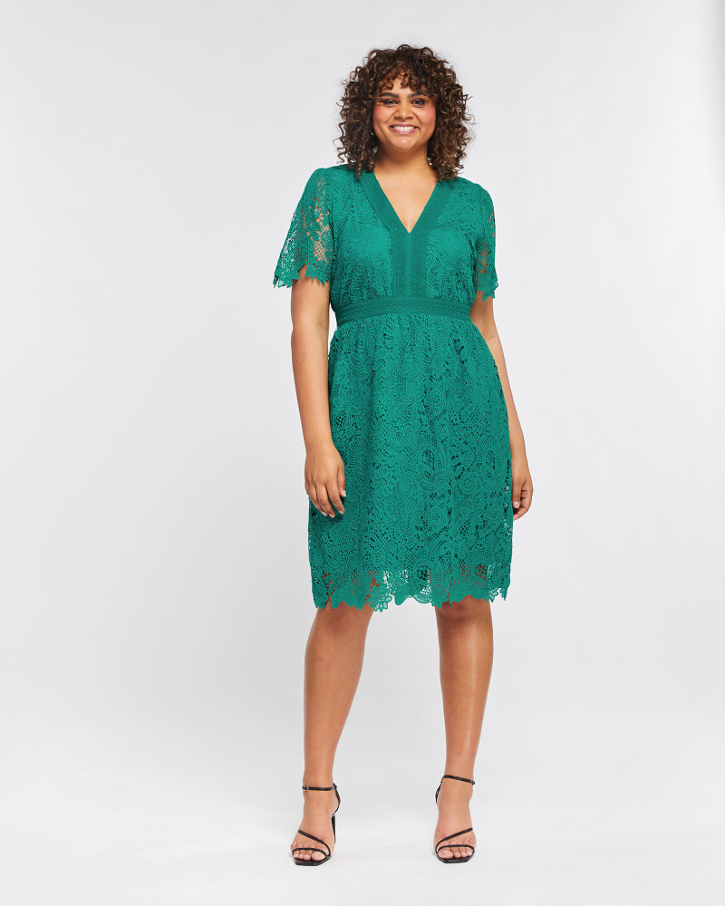 Front of a model wearing a size 4X Shire Lace Dress in Apple by Estelle. | dia_product_style_image_id:264657